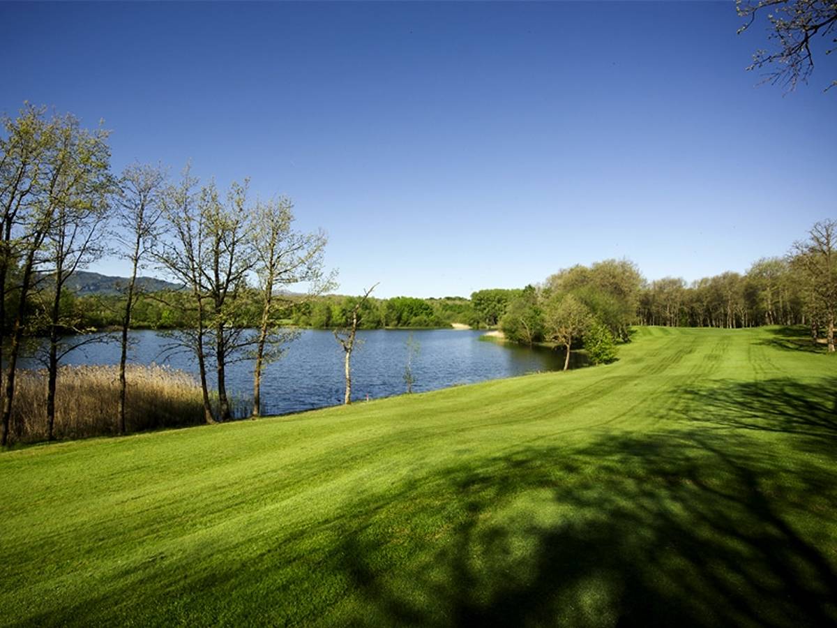 A fairway at Izki Golf running alongside a lake in Izki Natural Park - a Seve Ballesteros-designed mountain course south of Vitoria