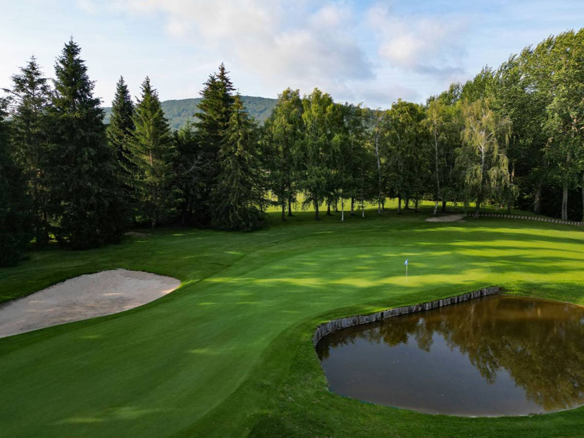 Green and pond at Larrabea Golf Club, Jon Rahm's home course above the Urrunaga reservoir in the Basque hills