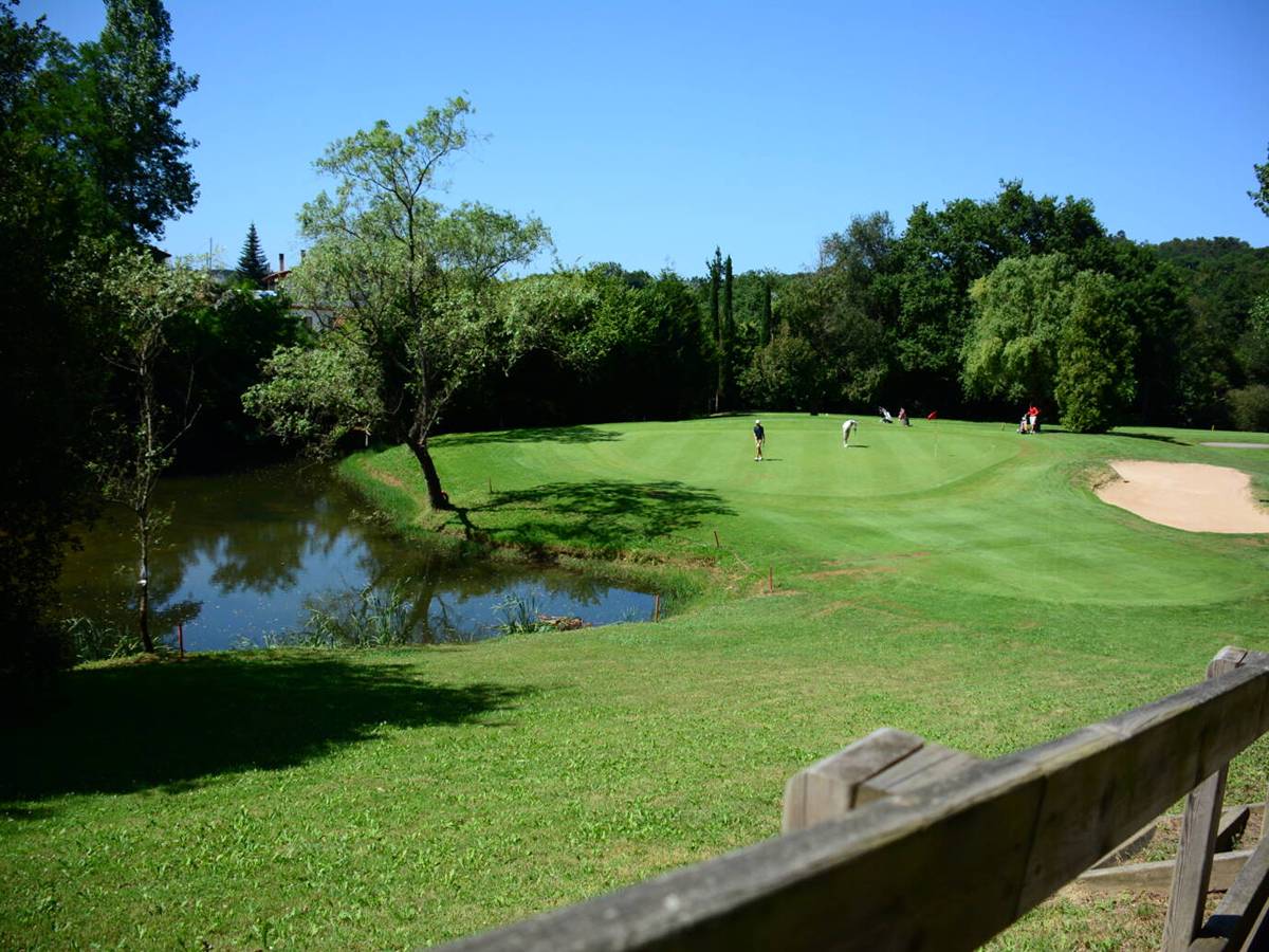 A green beside a pond at Laukariz - a parkland course in the hills north of Bilbao
