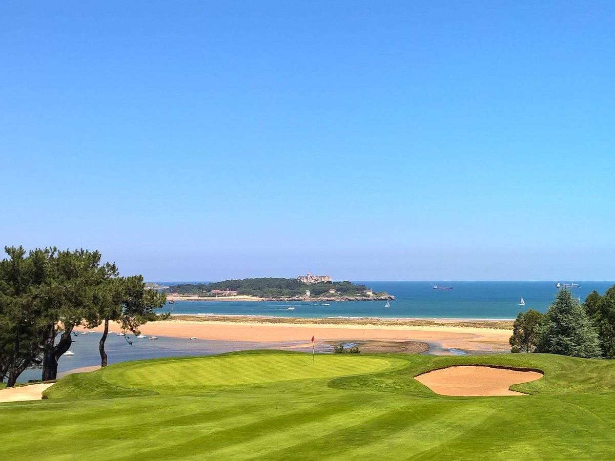 A bunkered green at Real Club de Golf de Pedreña, with the beach and the Bay of Biscay stretching out behind - Seve Ballesteros's home course near Santander