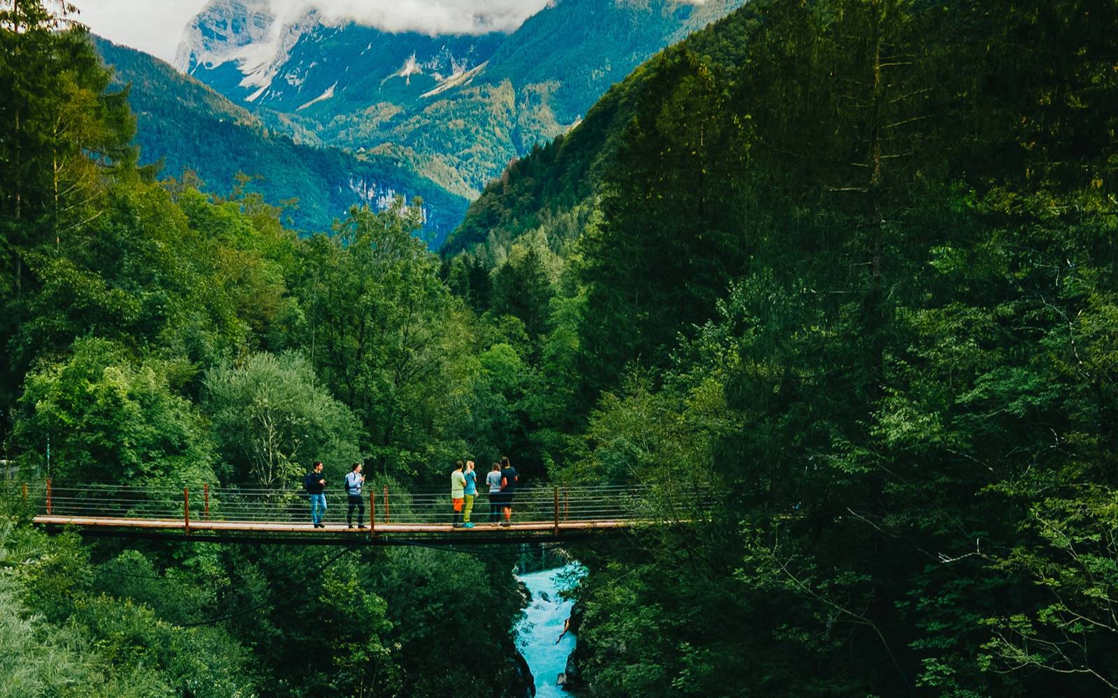 Tourists crossing the bridge to Skocjan caves in Slovenia