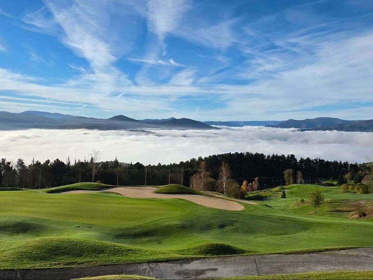 A fairway at Uraburu Golf (Ganguren) rising above a sea of morning cloud - the José María Olazábal-designed course in the hills above Bilbao